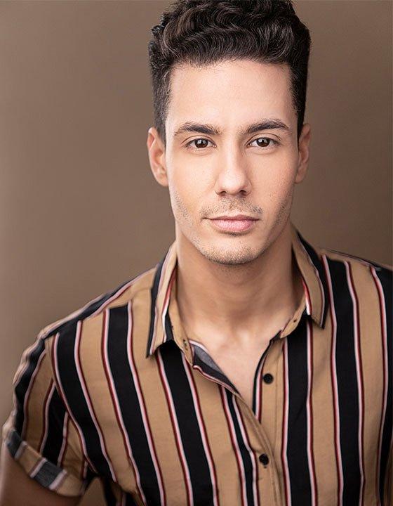 Professional headshot of Alex Gil Cruz